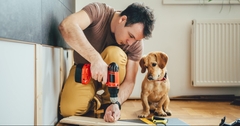 Man and dog with power tools