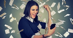 Woman with money raining around her