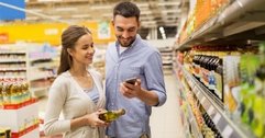 Couple on phone at grocery store