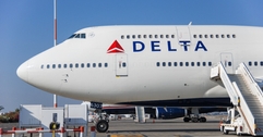 delta airplane parked on tarmac