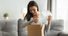 Woman opening an Amazon package 