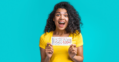 Woman holding lottery ticket