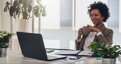woman working on laptop at office