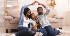 Couple with child in living room