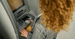 person using ATM