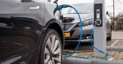 Electric vehicles are being charged at a charging station.