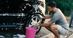 person washing car