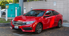 red honda civic in a parking lot