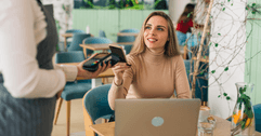 person paying bill at restaurant