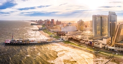 Atlantic City, New Jersey, as seen from aerial view featuring boardwalk and buildings