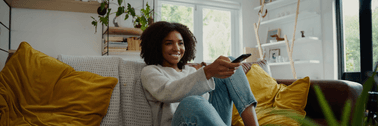 person with remote control in hand