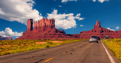 Cars on highway in Monument Valley, Utah