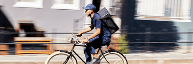 person working delivery gig on bike