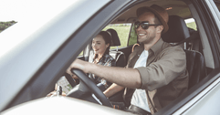 Couple driving in SUV