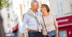 Older couple walking on street