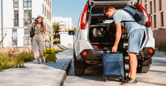 Young couple packing car 