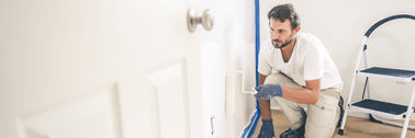 Man painting wall for odd job