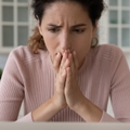 Shocked hispanic female read unexpected bad news on pc