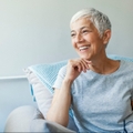 mature woman relaxing on her couch at home in the sitting room