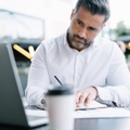 businessman using laptop computer for informative research