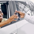 lady getting keys by car