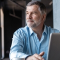 mature businessman working on laptop