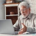 worried senior man unable to make utility bill
