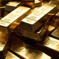 stacked of gold bars piling up