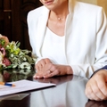 couple signing marriage agreement
