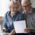 retired couple reading good news