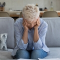 senior woman stressed while working