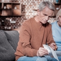 concentrated  woman pointing at document