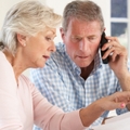 retired couple with household bills