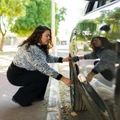 woman getting a flat tire