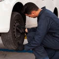 mechanic rotating tires