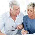 senior couple reviewing finances together