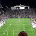 Fans are cheering at a football game.