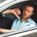 man showing dislike sign