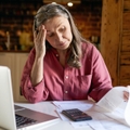 Retired woman sitting at table