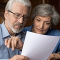 senior couple reviewing insurance policy together