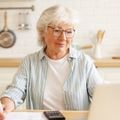 Senior paying electricity bills online