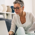 elderly woman doing taxes 