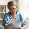 older woman reading document