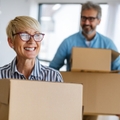 portrait of happy senior couple in love moving in new home