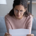 woman in glasses frustrated and confused
