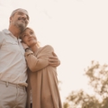 Happily retired couple at sunset