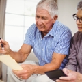 senior couple calculating bills