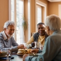 happy seniors talk while eating lunch