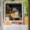 truck carrying goods moving house