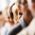 A woman out of focus with a group of people